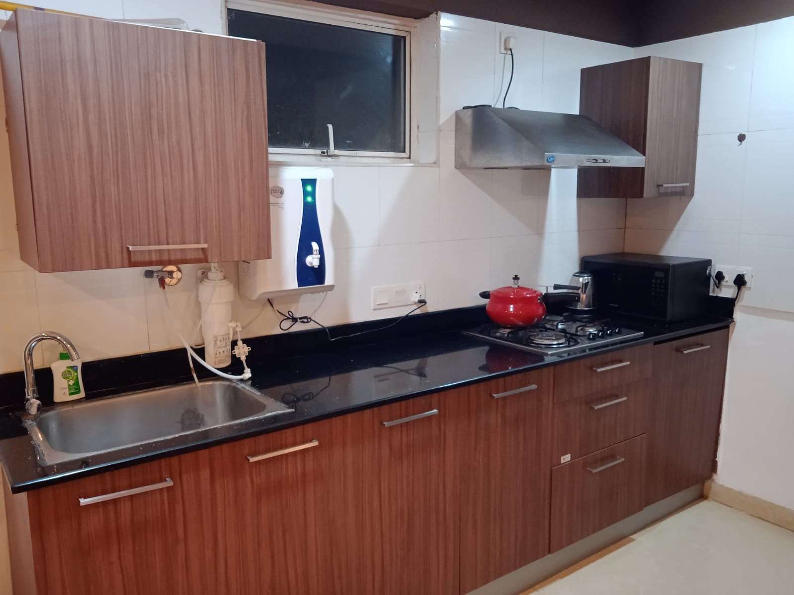 Fully equipped modular kitchen with cooking appliances